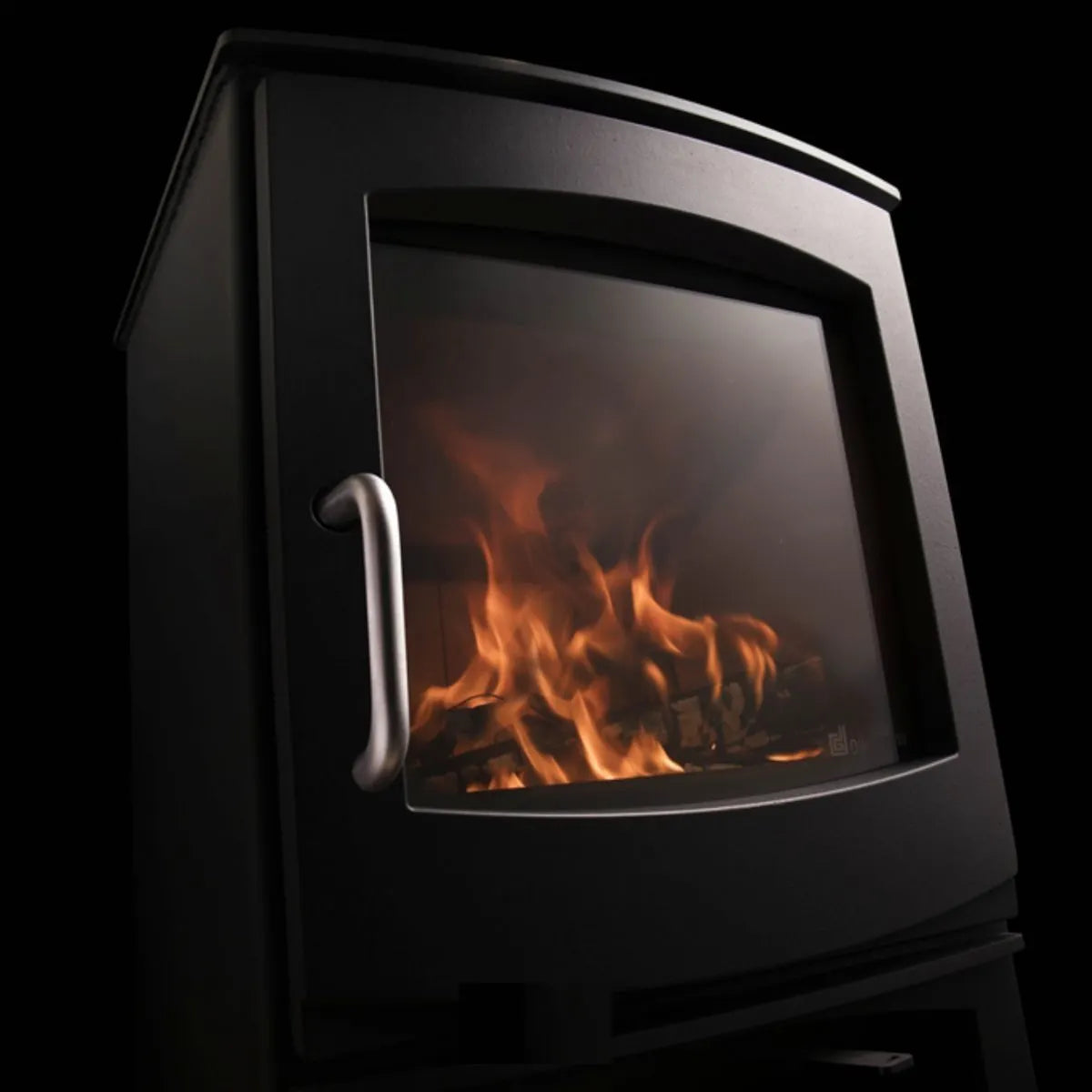 Dik Guerts Ivar 5 Logburner on a black background. Stove is lit.