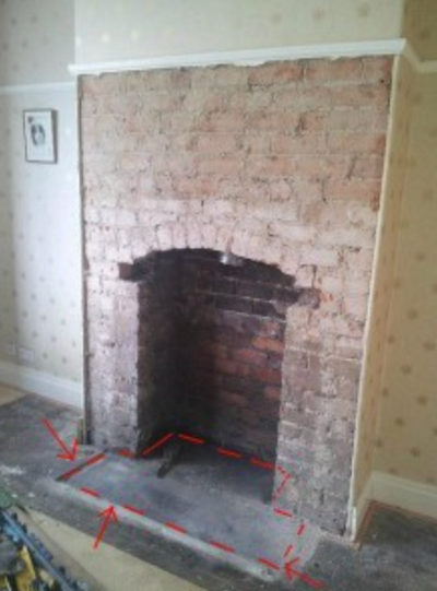 dotted line overlayed onto fireplace recess showing the size of the t-shaped hearth