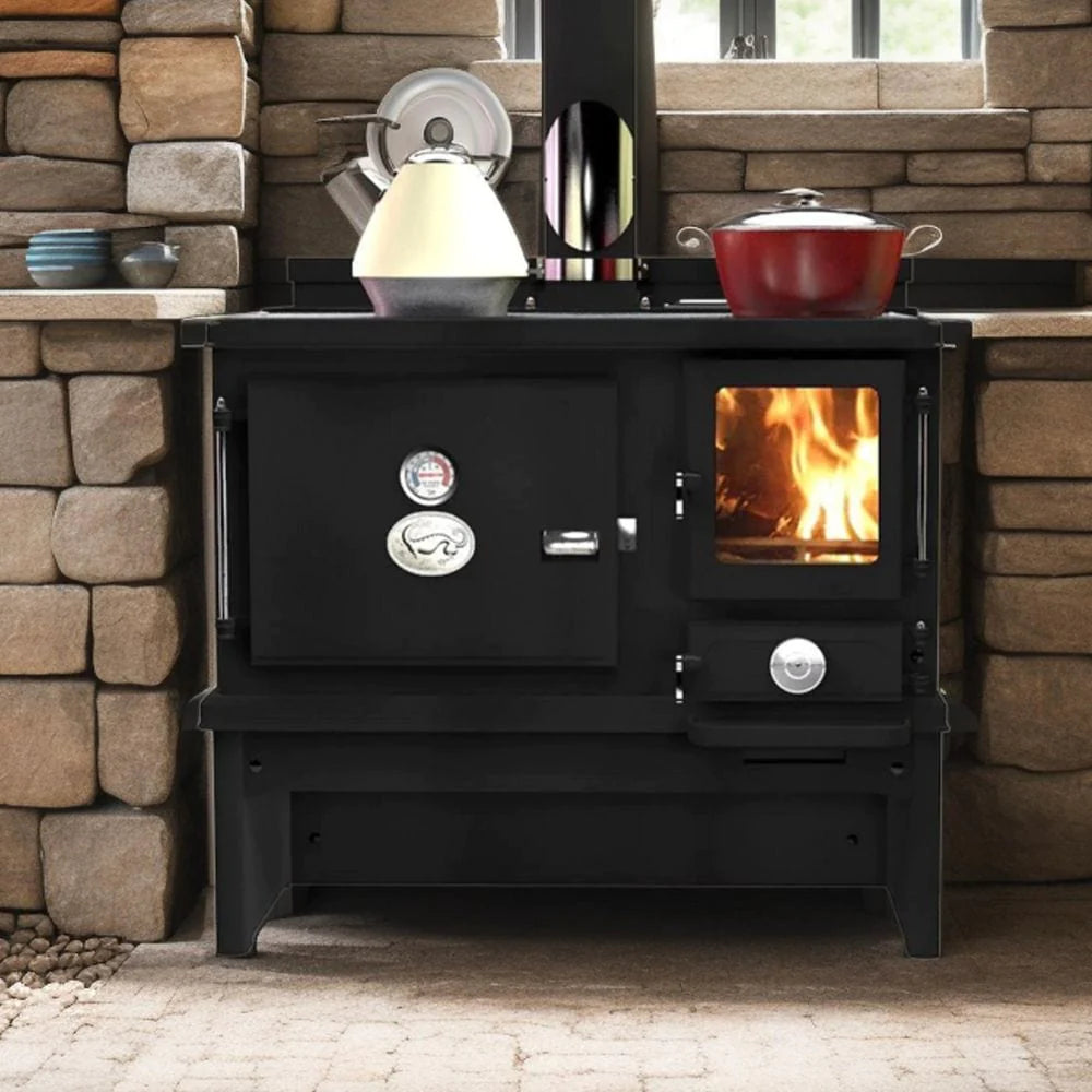 Hobbit range cooker in stone kitchen with pan and kettle on top.