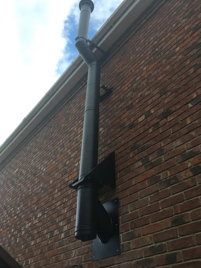 Twin wall chimney in black offset around eaves