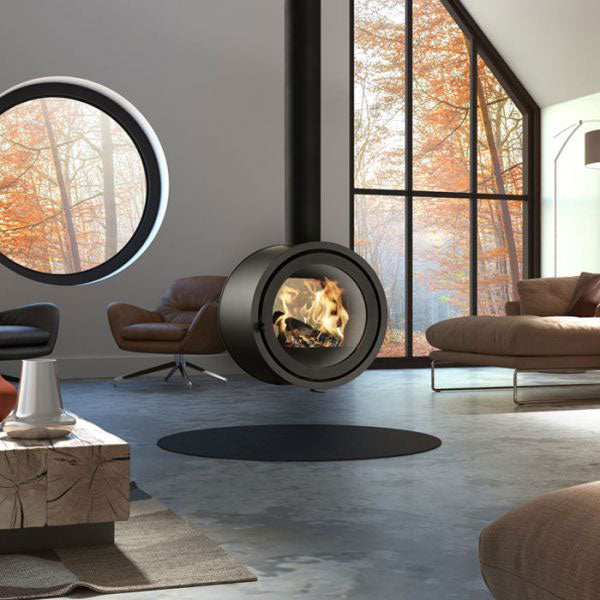 Dik Guerts Odin double sided wood stove hanging into a beautiful room