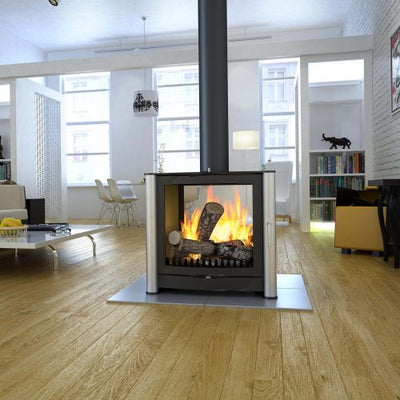 A large double sided stove on a tiled hearth atop a wooden floor