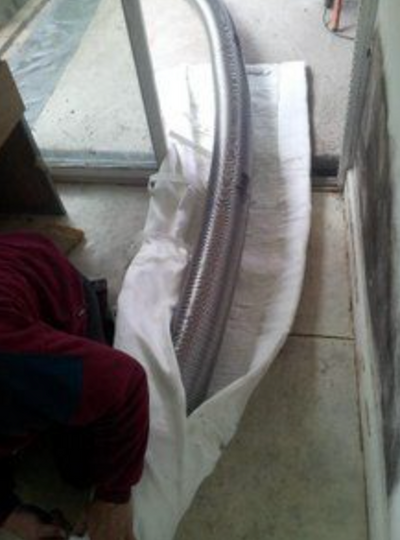 Wrapping a chimney liner with blanket insulation