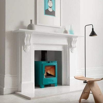 Hamlet Stoves Hamlet Solution 5 Multifuel Wood Burning Stove 5kW S4 British pictured in Miami electric blue in a white room in a white recess