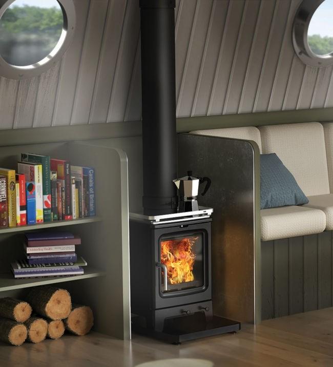 Saltfire Stoves Saltfire Peanut 3 Wood Burning Stove 3kW Small Cast Iron in a small room with heat shields