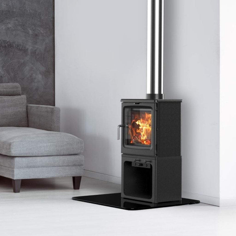 Saltfire Stoves Saltfire Peanut 5 Wood Burning Stove with a log store 5kW Cast Iron shown in a room