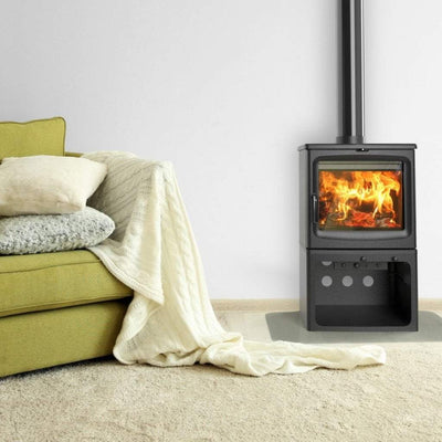 Saltfire Peanut 8 on a logstore in a room next to a comfy sofa